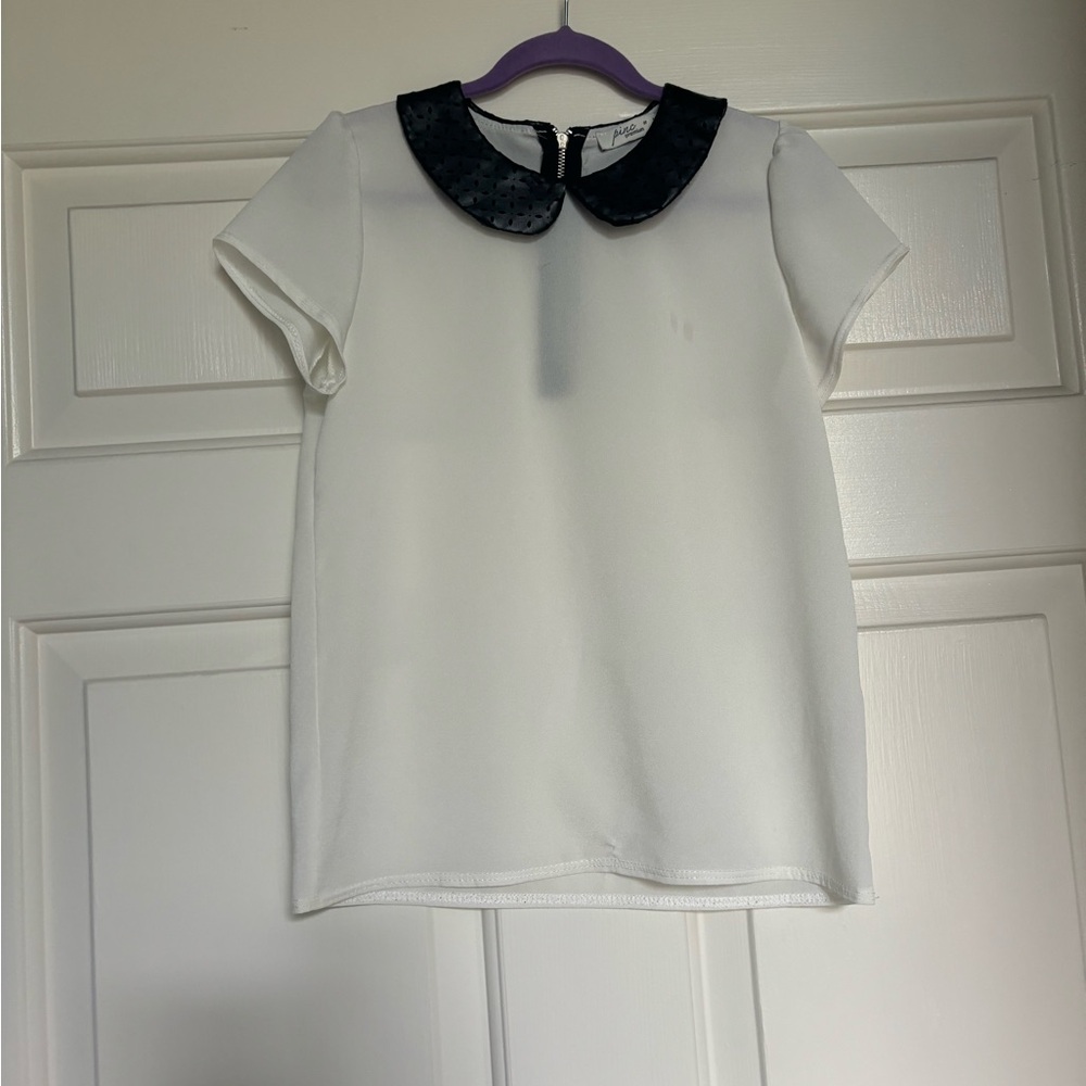 Pirc Bloomingdale’s white and black blouse with collar details